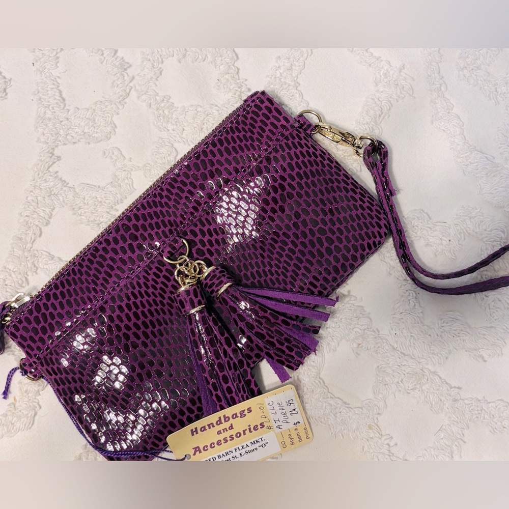 Plum tasseled wristlet